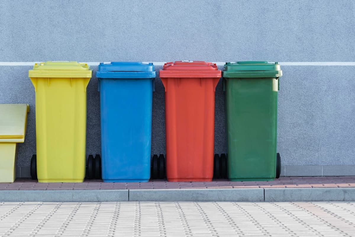Colourful recycling bins side by side