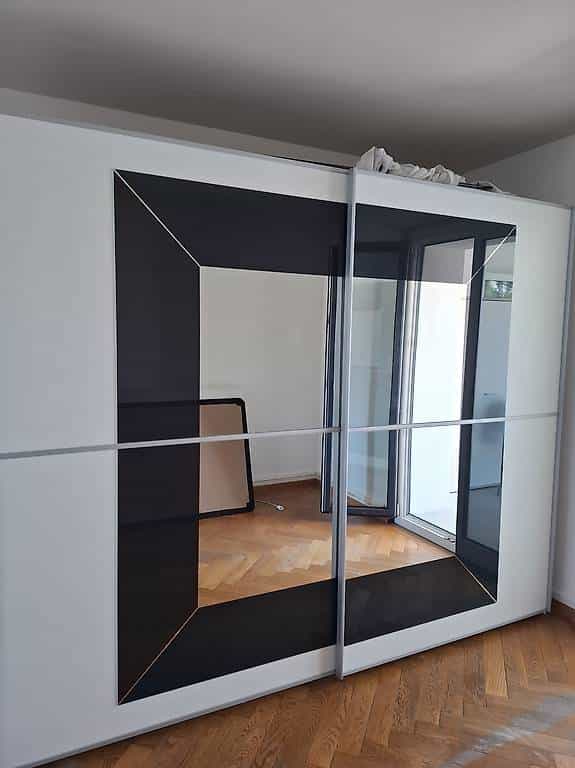 Grande armoire portes coulissantes miroir
