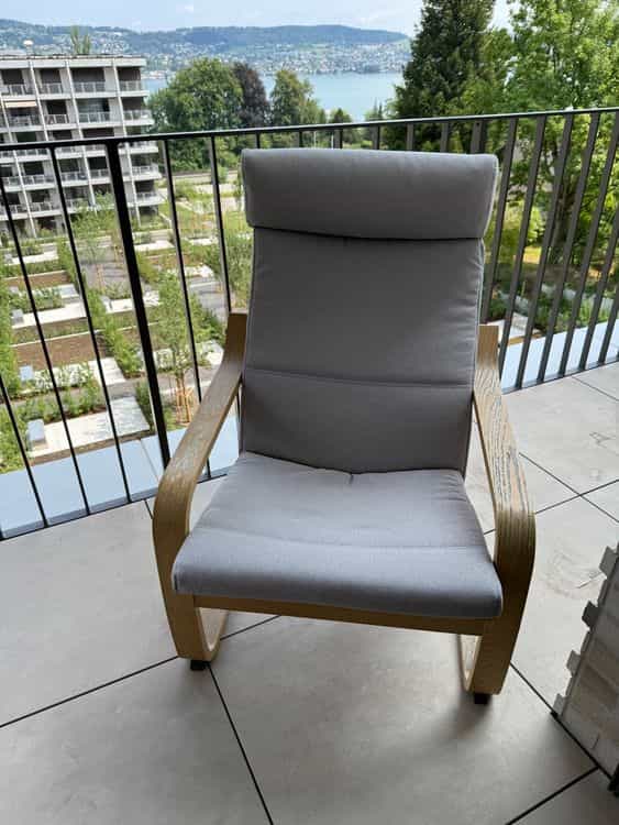 Armchair with wooden frame, grey upholstery