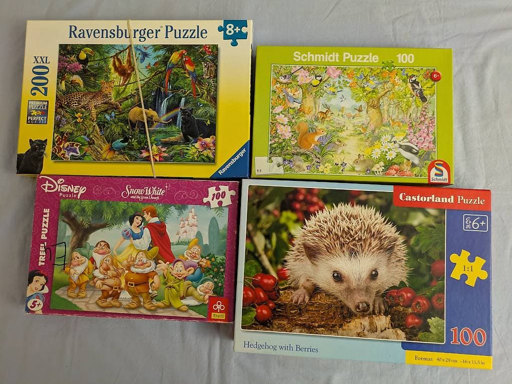 4 Puzzle zu verschenken, bei jedem Puzzle fehlt 1 Teil