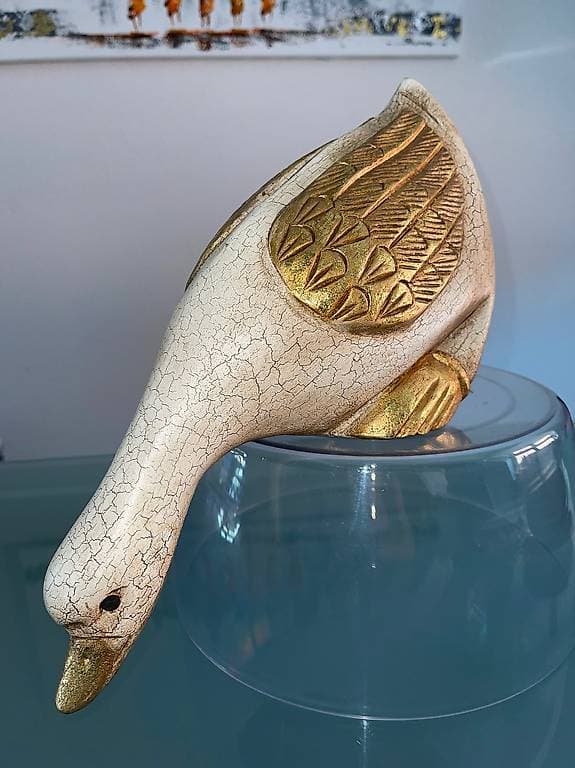 Enten aus Holz, goldene Flügel
